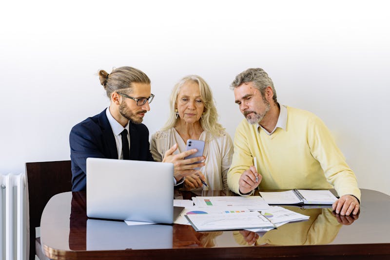 a couple talking to a loan officer